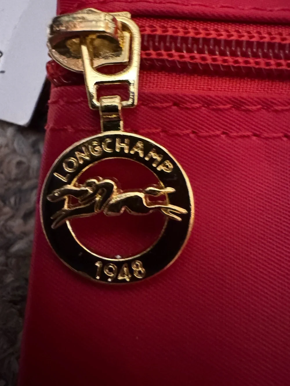 Longchamp Red Crossbody Bag with Brown Strap and Gold Accents